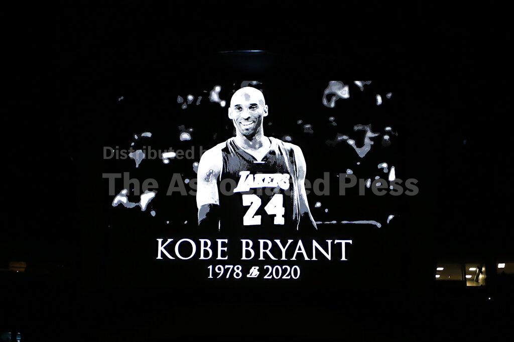 A tribute to Kobe Bryant was shown on the screen before the start of an NBA basketball game between the Orlando Magic and the Los Angeles Clippers in Orlando, Fla., Sunday, Jan. 26, 2020. (AP Photo/Reinhold Matay)