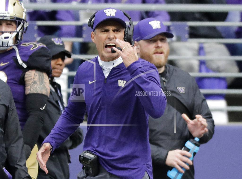 Ted S. Warren Washington head coach Chris Petersen calls to his team during the first half of an NCAA college football game against Colorado, Saturday, Oct. 20, 2018, in Seattle. (AP Photo/Ted S. Warren)