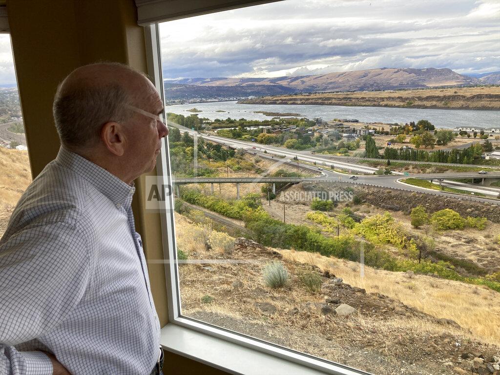 Andrew Selsky In this Tuesday, Oct. 5, 2021, photo, The Dalles Mayor Richard Mays looks at the view of his town and the Columbia River from his hilltop home in The Dalles, Oregon. Mays helped negotiate a proposal by Google to build new data centers in the town. The data centers require a lot of water to cool their servers, and would use groundwater and surface water, but not any water from the Columbia River. (AP Photo/Andrew Selsky)