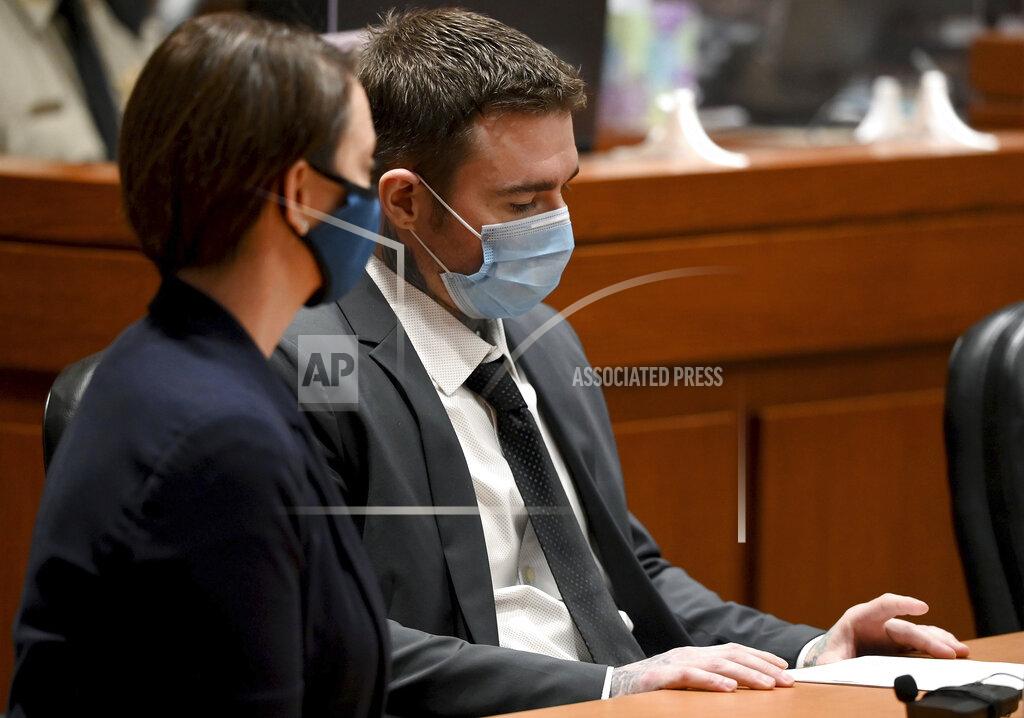 Jill Toyoshiba Kylr Yust, right, and attorney Molly Hastings sits at the defense table after the judge informed Yust of the jury's sentencing recommendations Friday, April 16, 2021, at the Cass County Justice Center in Harrisonville, Missouri. The jury in the murder trial recommended a sentence of 15 years for voluntary manslaughter of Kara Kopetsky and a life sentence (30 years) for the second-degree murder of Jessica Runions Friday, April 16, 2021. Sentencing is set for June 7. (Jill Toyoshiba/The Kansas City Star via AP)