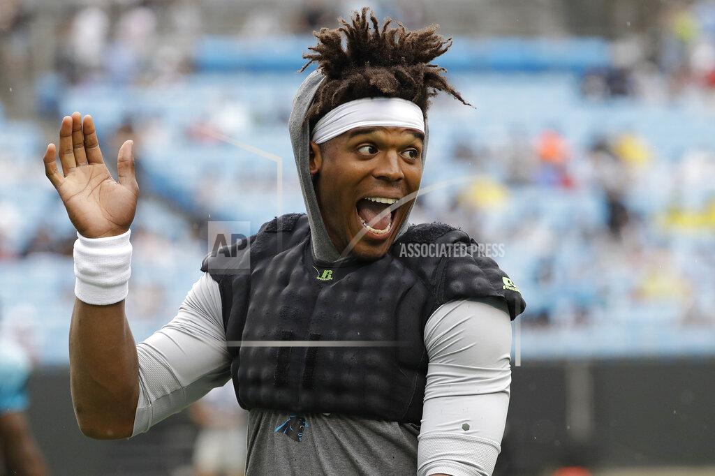 Chuck Burton Carolina Panthers quarterback Cam Newton waves to the crowd during a Fan Fest practice at the NFL football team's training camp in Charlotte, N.C., Friday, Aug. 2, 2019. (AP Photo/Chuck Burton)