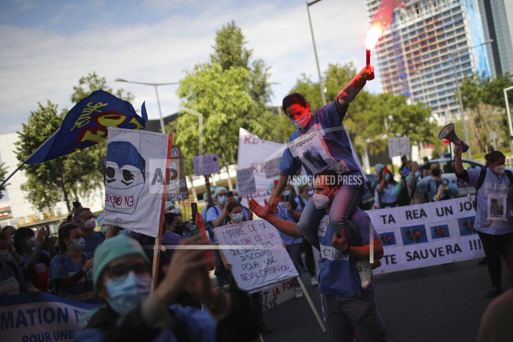 Daniel Cole Striking ICU nurses demonstrate in Marseille, southern France, Tuesday, May, 11, 2021 to demand better pay and working conditions as the government gradually reopen the country. (AP Photo/Daniel Cole)
