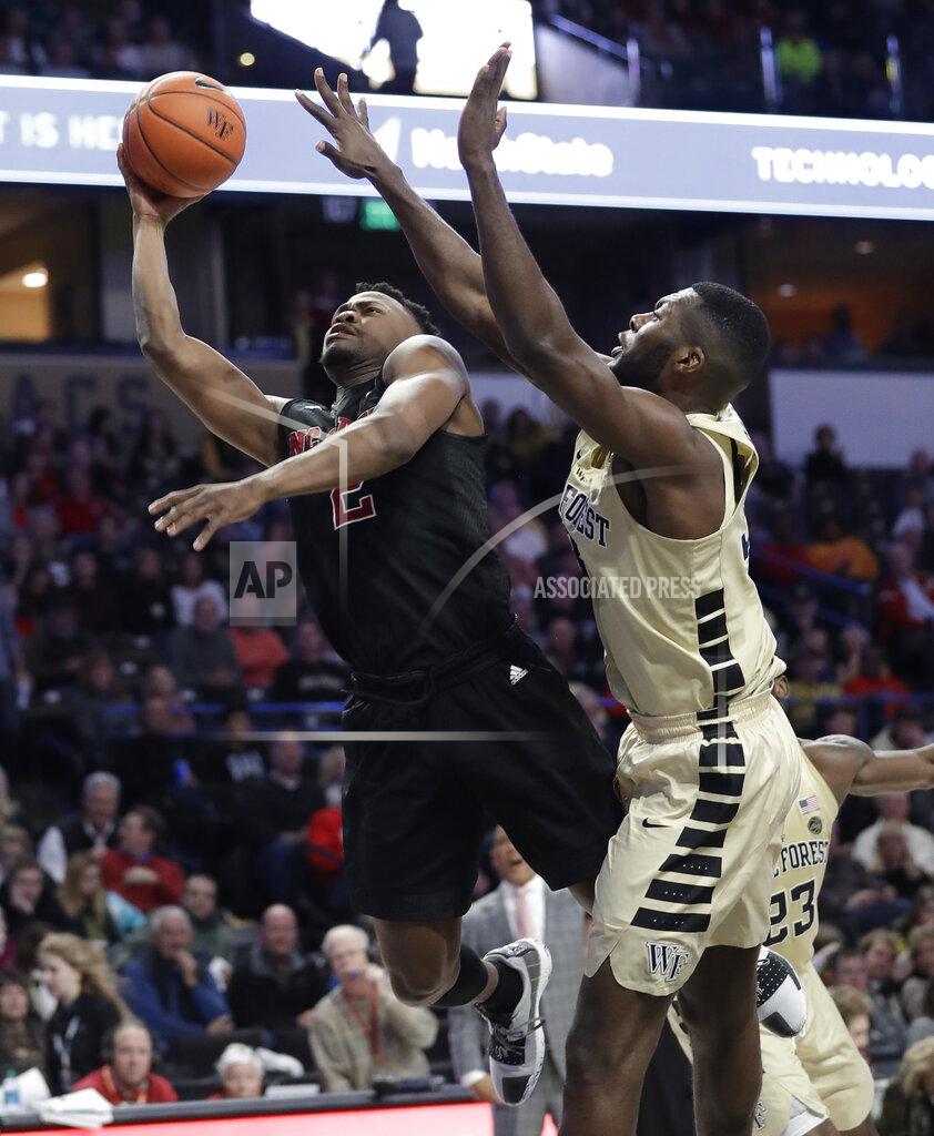 Chuck Burton North Carolina State's Torin Dorn (2) drives past Wake Forest's Ikenna Smart during the second half of an NCAA college basketball game in Winston-Salem, N.C., Tuesday, Jan. 15, 2019. (AP Photo/Chuck Burton)