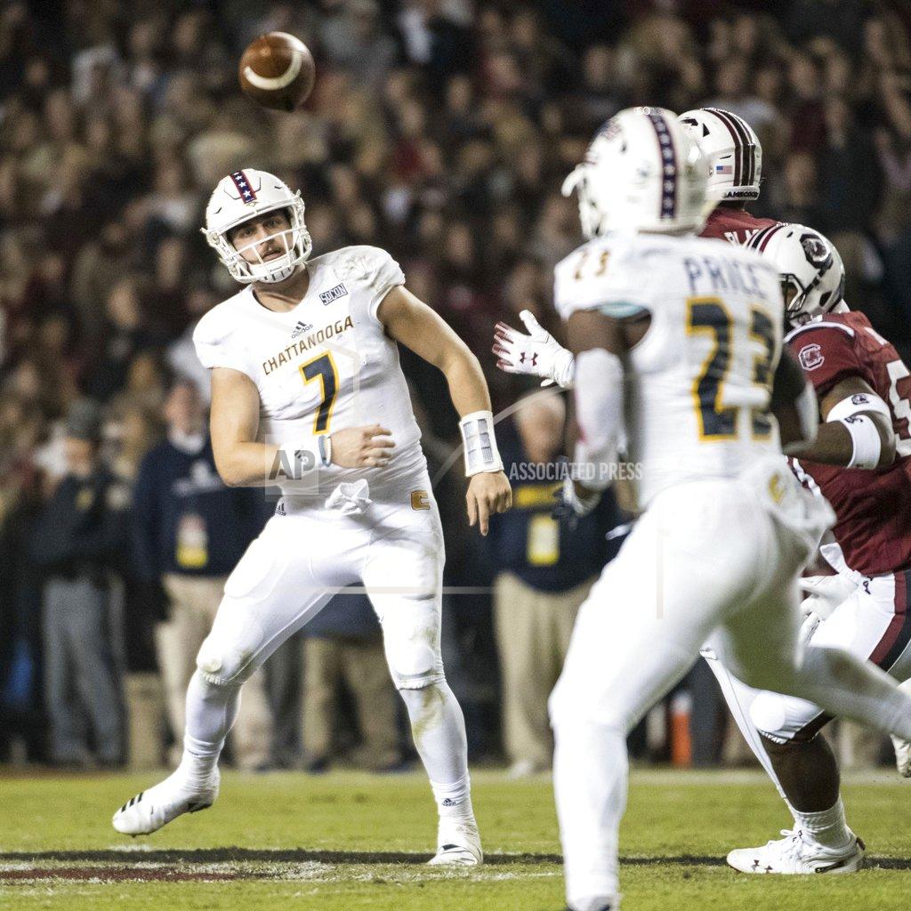 Sean Rayford Chattanooga quarterback Nick Tiano (7) throws a pass to Tyrell Price (23) during the first half of an NCAA college football game against South Carolina Saturday, Nov. 17, 2018, in Columbia, S.C. (AP Photo/Sean Rayford)