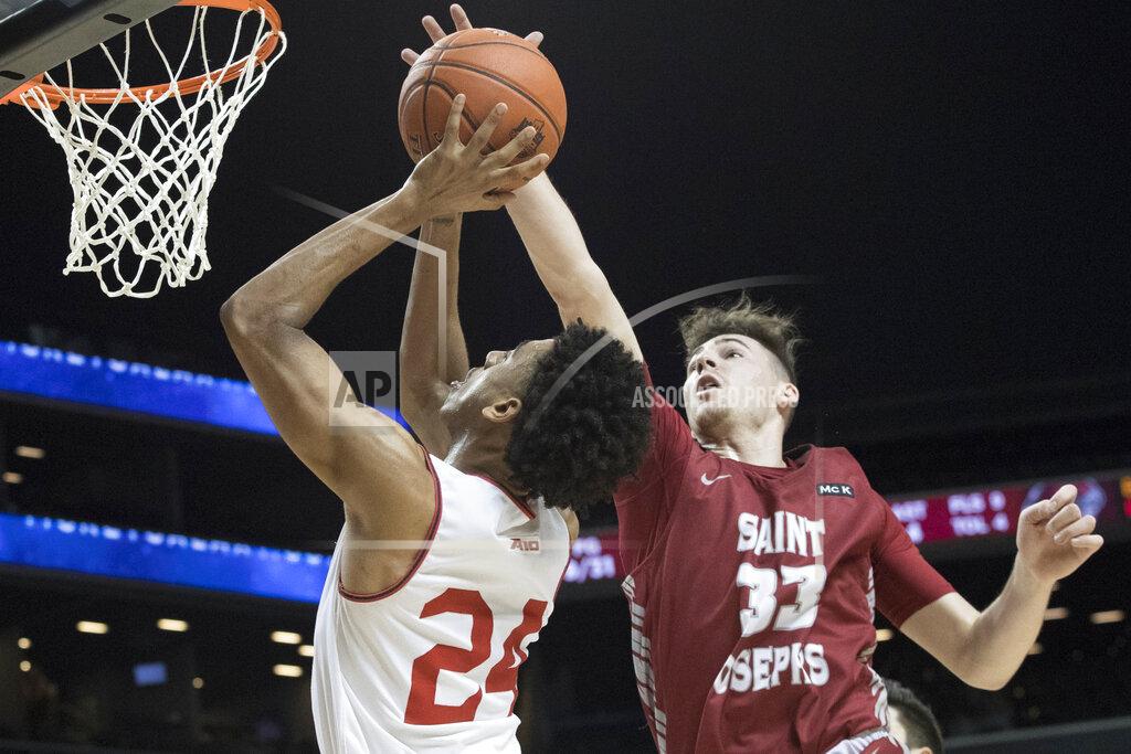 Mary Altaffer Saint Joseph's forward Taylor Funk (33) stops Davidson guard Carter Collins (24) from scoring during the first half of an NCAA college basketball game in the Atlantic 10 Conference tournament, Friday, March 15, 2019, in New York. (AP Photo/Mary Altaffer)