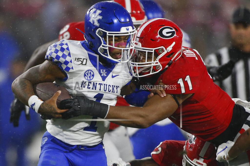 Joshua L. Jones Georgia linebacker Jermaine Johnson (11) takes down Kentucky quarterback Lynn Bowden Jr. (1) during the first half of an NCAA college football game Saturday, Oct. 19, 2019, in Athens, Ga. (Joshua L. Jones/Athens Banner-Herald via AP)