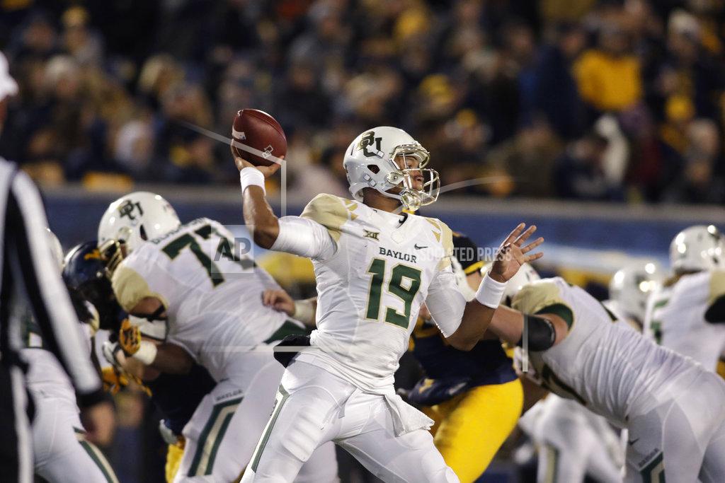 Ray Thompson Baylor quarterback Jalan McClendon (19) attempts a pass during the second half of an NCAA college football game against Wet Virginia, Thursday, Oct. 25, 2018, in Morgantown, W.Va. (AP Photo/Raymond Thompson)