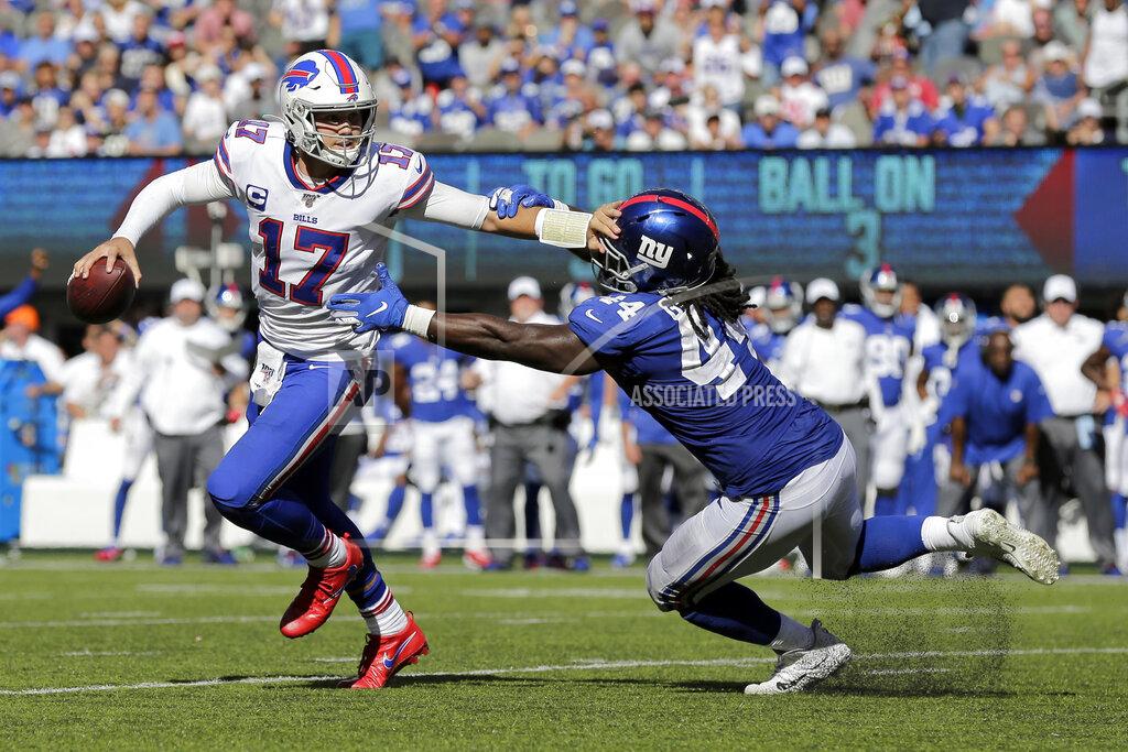 Adam Hunger Buffalo Bills quarterback Josh Allen, left, evades New York Giants' Markus Golden during the second half of an NFL football game, Sunday, Sept. 15, 2019, in East Rutherford, N.J. (AP Photo/Adam Hunger)