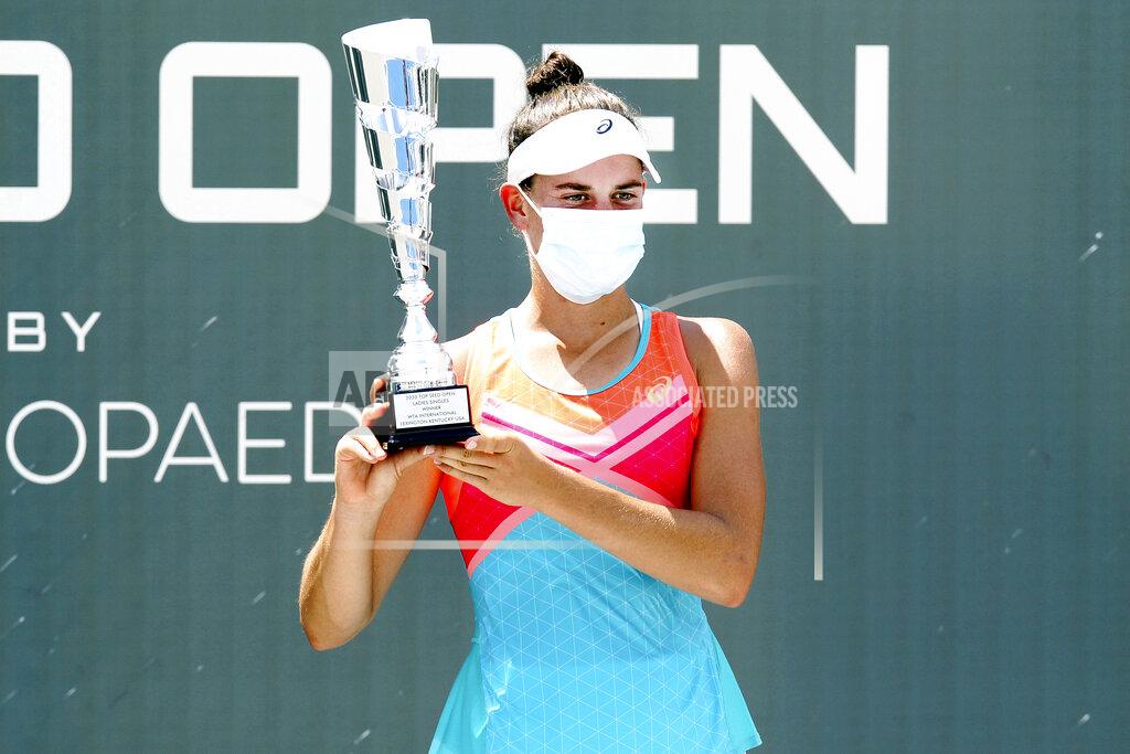 James Crisp Jennifer Brady holds the championship trophy after defeating Jil Belen Teichmann in the WTA tennis tournament championship match in Nicholasville, Ky., Sunday, Aug. 16, 2020. Brady defeated Teichmann. Brady won 6-3, 6-4 on the way to her first WTA title. (AP Photo/James Crisp)
