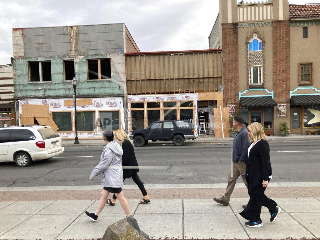 Andrew Selsky In this Tuesday, Oct. 5, 2021, photo, people walk in the streets undergoing a renewal project to fix decayed buildings downtown The Dalles, Oregon. As demand for cloud computing grows, the world's biggest tech companies are building more data centers, including in arid regions even though they use vast amounts of water per day. Some residents of The Dalles, Oregon, are objecting to a proposal by Google to build more data centers there, fearing that, amid rising temperatures and drought, there won't be enough water for everyone. (AP Photo/Andrew Selsky)