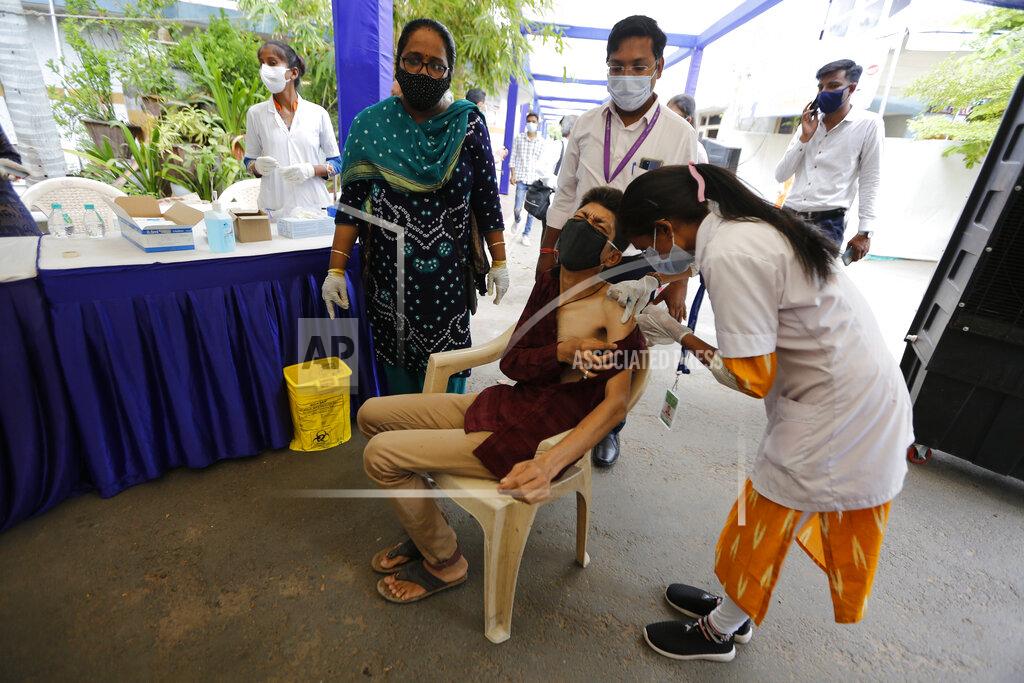 Ajit Solanki A physically disabled man gets a dose of Covishield, Serum Institute of India's version of the AstraZeneca COVID-19 vaccine, during a drive through vaccination organized for disabled people in Ahmedabad, India, Saturday, June 12, 2021. (AP Photo/Ajit Solanki)