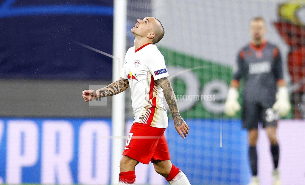 Jan Woitas Leipzig's Angelino, right, celebrates after scoring, during a Group H Champions League soccer match between RB Leipzig and Istanbul Basaksehir at the RB Arena in Leipzig, Germany, Tuesday Oct. 20, 2020. (Jan Woitas/dpa via AP)
