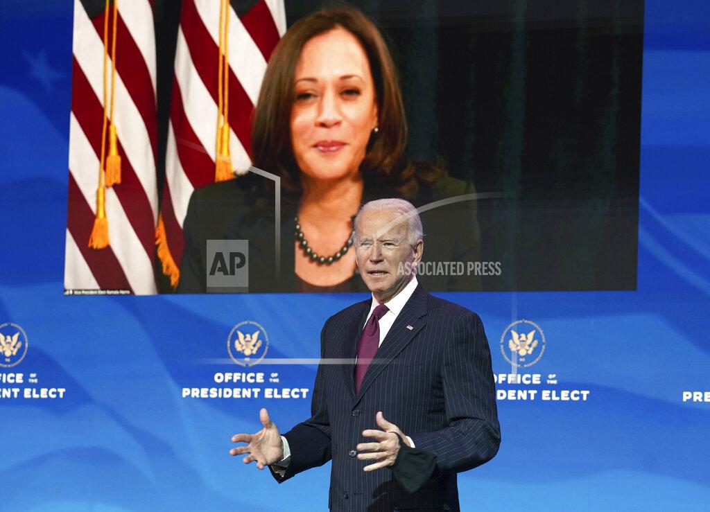 Kevin Lamarque President-elect Joe Biden speaks as Vice President-elect Kamala Harris looks on via video during a news conference at The Queen theater in Wilmington, Del., Wednesday, Dec. 16, 2020. (Kevin Lamarque/Pool via AP)