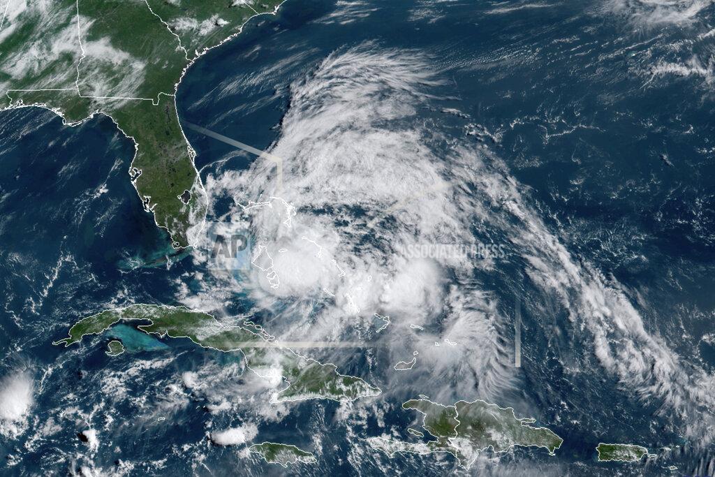 Uncredited This GOES-16 GeoColor satellite image taken Saturday, Aug. 1, 2020, at 9:40 a.m. EDT., and provided by NOAA, shows Hurricane Isaias over the Bahamas. Hurricane Isaias snapped trees and knocked out power as it blew through the Bahamas on Saturday and headed toward the Florida coast, where officials said they were closing beaches, parks and coronavirus testing sites. (NOAA via AP)