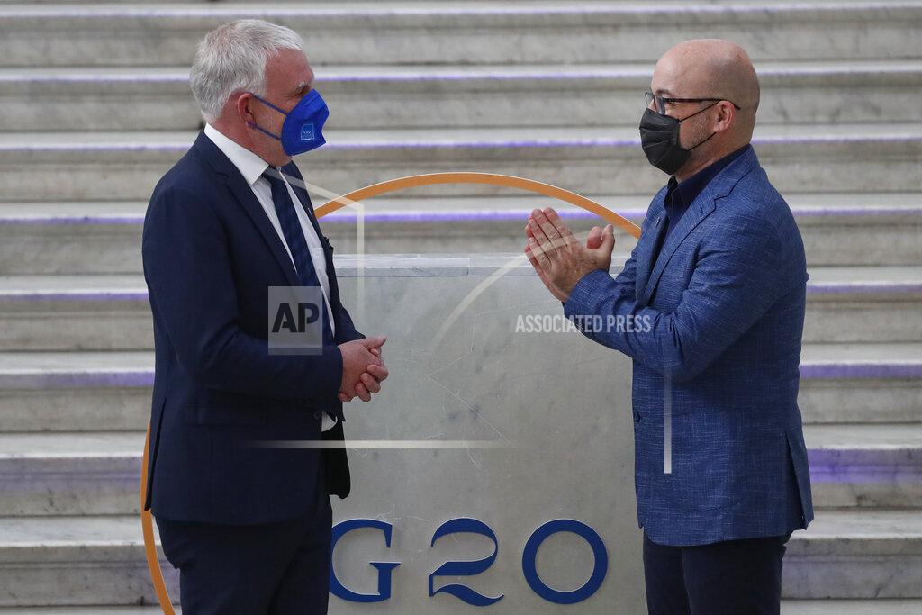 Salvatore Laporta German undersecretary of environment Jochen Flasbarth is welcomed by Italian Minister for Ecological Transition Roberto Cingolani as he arrives at Palazzo Reale in Naples, Italy, Thursday, July 22, 2021, to take part in a G20 meeting on environment, climate and energy. (AP Photo/Salvatore Laporta)