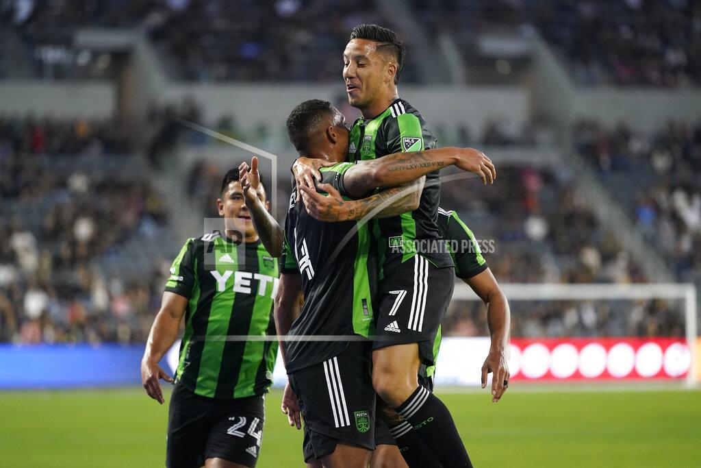 Ashley Landis Austin FC defender Nick Lima (24), defender Ruben Gabrielsen (4), and defender Julio Cascante (18) celebrate after Gabrielsen scored a goal during the first half of an MLS soccer match against the Los Angeles FC in Los Angeles, Wednesday, May 18, 2022. (AP Photo/Ashley Landis)