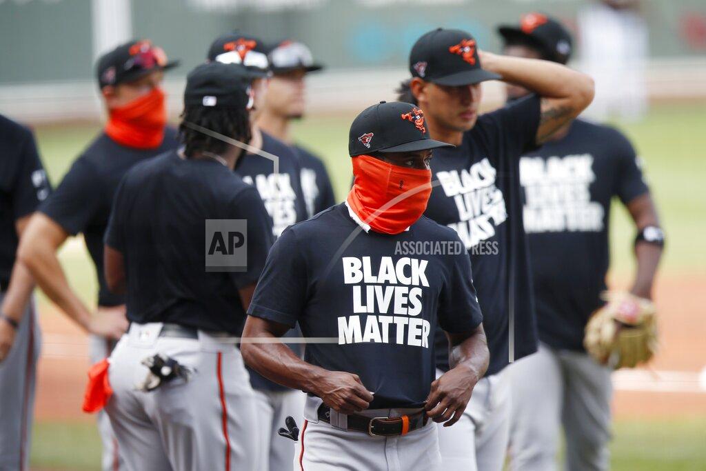 Michael Dwyer Baltimore Orioles players warm up in Black Lives Matter T-shirts before an opening day baseball game against the Boston Red Sox at Fenway Park, Friday, July 24, 2020, in Boston. (AP Photo/Michael Dwyer)