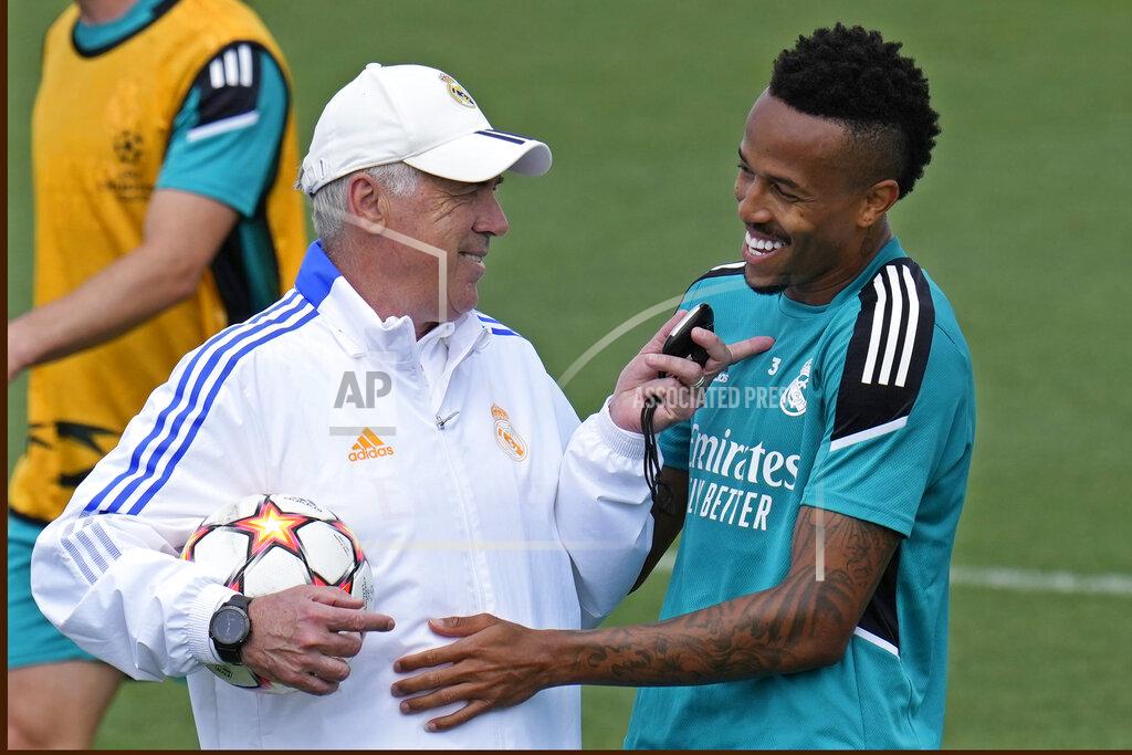 Manu Fernandez Real Madrid's head coach Carlo Ancelotti, left, talks with Real Madrid's Eder Militao during a Media Opening day training session in Madrid, Spain, Tuesday, May 24, 2022. Real Madrid will play Liverpool in Saturday's Champions League soccer final in Paris. (AP Photo/Manu Fernandez)