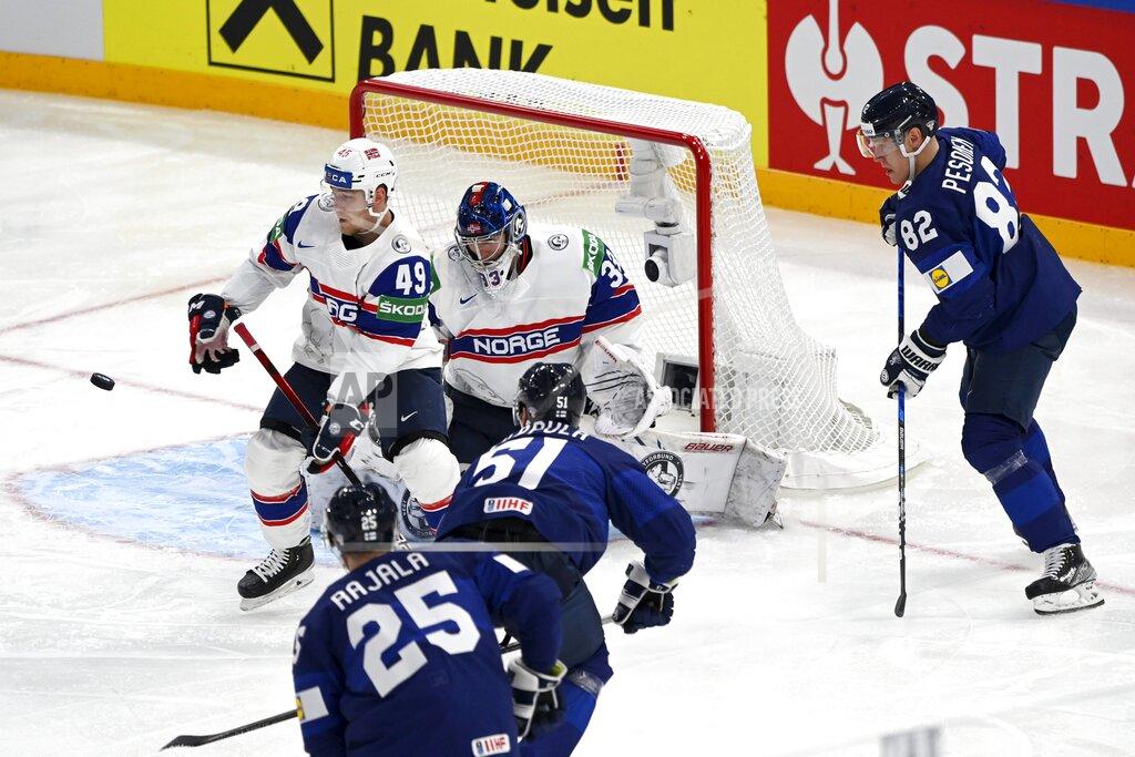 Emmi Korhonen Norway's Christian Kaasastul, left, defends as goalie Henrik Haukeland, center, makes a save on an attack from Finland's Toni Rajala, no. 25, Valtteri Filppula, no. 51, and Harri Pesonen, right, during their preliminary round group B Hockey World Championship match between Finland and Norway in Tampere, Finland, Friday May 13, 2022. (Emmi Korhonen/Lehtikuva via AP)