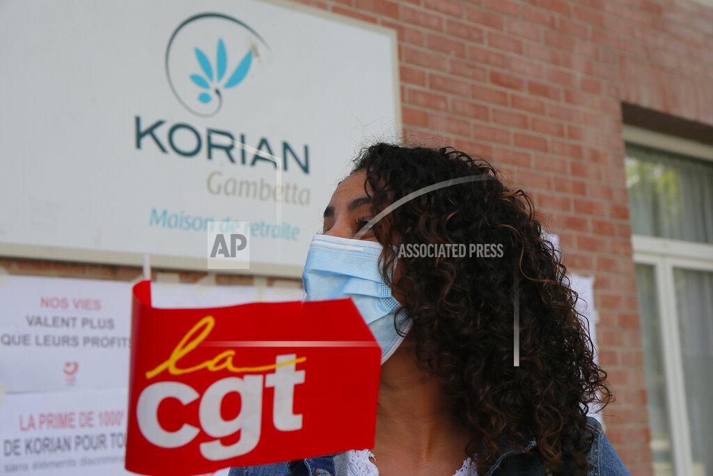 Michel Spingler Employees demonstrate outside a nursing home of the Korian group, one of the market leaders in the lucrative industry of providing care and assisted living facilities for older adults, Monday, May 25, 2020 in Lille, northern France. In France, the group is facing several lawsuits filed by families who have lost loved ones during the coronavirus pandemic that has caused thousands of deaths in French care homes. (AP Photo/Michel Spingler)