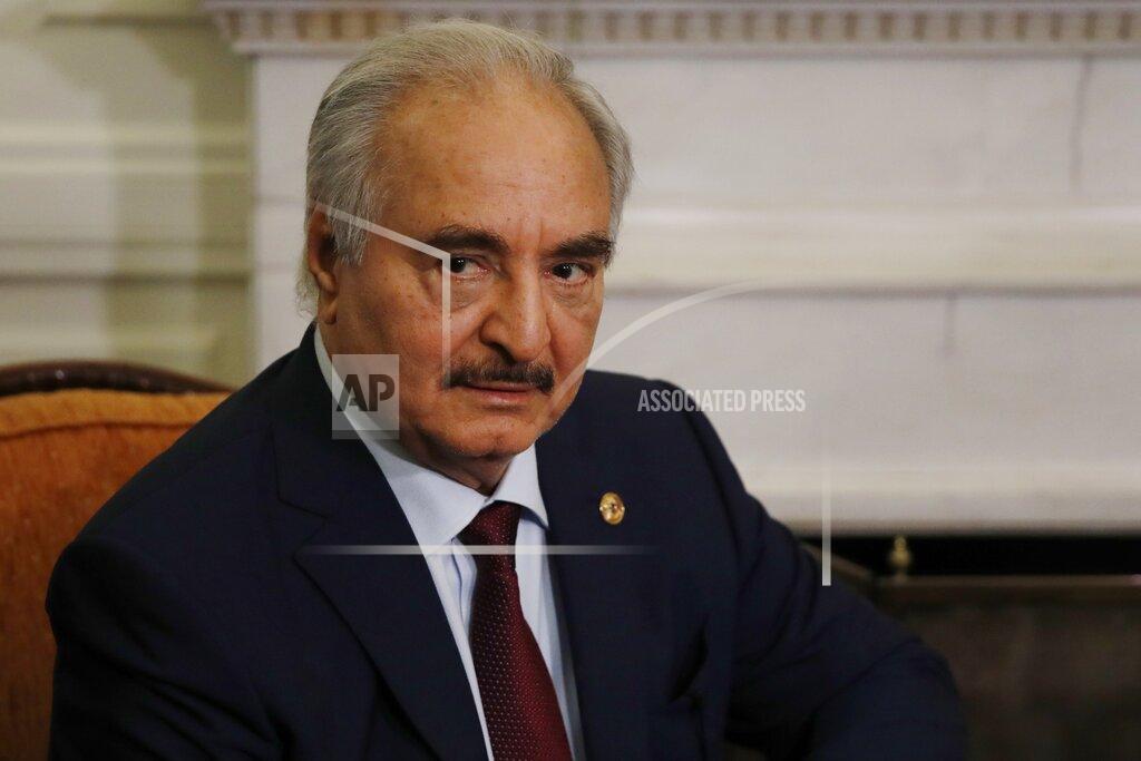 FILE - In this Jan. 17, 2020, file, photo, Libyan Gen. Khalifa Hifter joins a meeting with the Greek Foreign Minister Nikos Dendias in Athens. The U.S. military Tuesday, May 26, 2020 accused Russia of deploying fighter planes to conflict-stricken Libya to support Russian mercenaries aiding east-based forces in their offensive on the capital, Tripoli. (AP Photo/Thanassis Stavrakis, File)