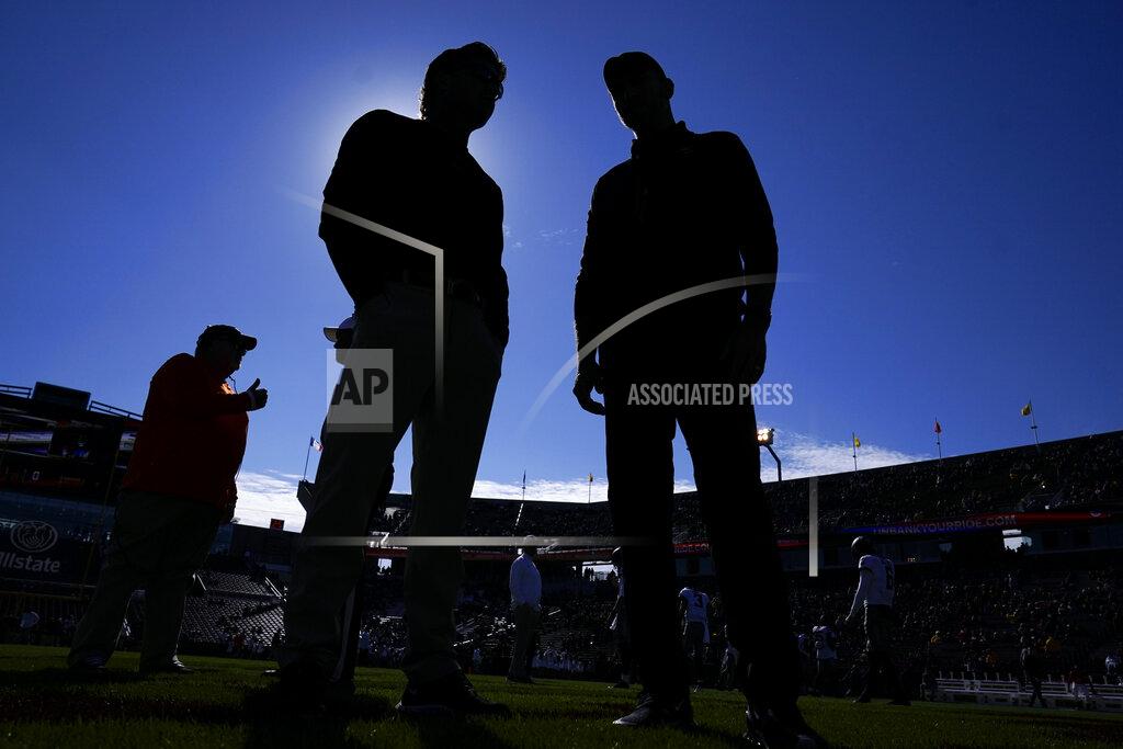 Charlie Neibergall Oklahoma State head coach Mike Gundy, left, talks with Iowa State head coach Matt Campbell before an NCAA college football game, Saturday, Oct. 23, 2021, in Ames, Iowa. (AP Photo/Charlie Neibergall)