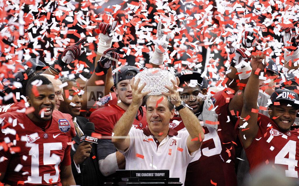 Gerald Herbert FILE - In this Jan. 9, 2012, file photo, Alabama head coach Nick Saban celebrates with his team after the BCS National Championship college football game against LSU, in New Orleans. Alabama won 21-0. The beginning of the decade, and of a dynasty. The Crimson Tide has been unquestionably the dominant team of the decade to this point, riding Saban's "Process" and a string of top recruiting hauls to nearly annual title contention. (AP Photo/Gerald Herbert, File)