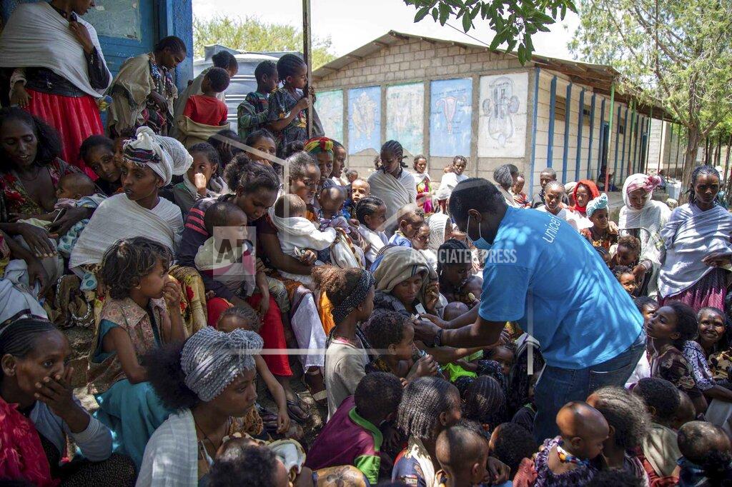 Christine Nesbitt UNICEF Nutrition Specialist Joseph Senesie screens children for malnutrition in Adikeh, in the Wajirat district of the Tigray region of northern Ethiopia Monday, July 19, 2021. For months, the United Nations has warned of famine in Tigray and now internal documents and witness accounts reveal the first starvation deaths since Ethiopia's government in June imposed what the U.N. calls "a de facto humanitarian aid blockade." (Christine Nesbitt/UNICEF via AP)