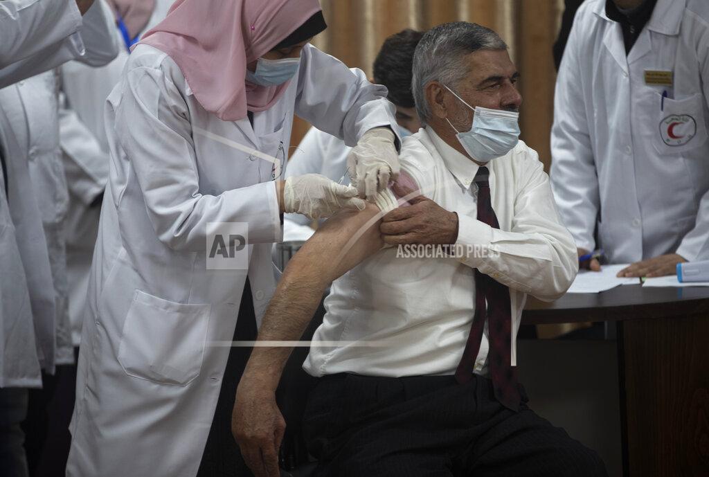 Khalil Hamra Palestinian Health Ministry official Yahya Aabed, receives a shot of the COVID-19 Russian-made Sputnik V vaccine, in Gaza City, Monday, Feb. 22, 2021. (AP Photo/Khalil Hamra)