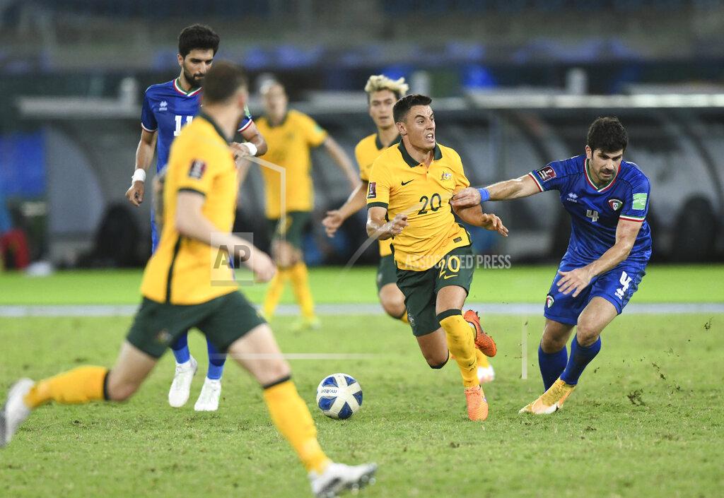 Jaber Abdulkhaleg Kuwait's Khaled Ibrahim, right, fights for the ball with Australia's Chris Ikonomidis during the World Cup 2022 Group B qualifying soccer match between Kuwait and Australia in Kuwait City, Kuwait, Thursday, June 3, 2021. (AP Photo/Jaber Abdulkhaleg)