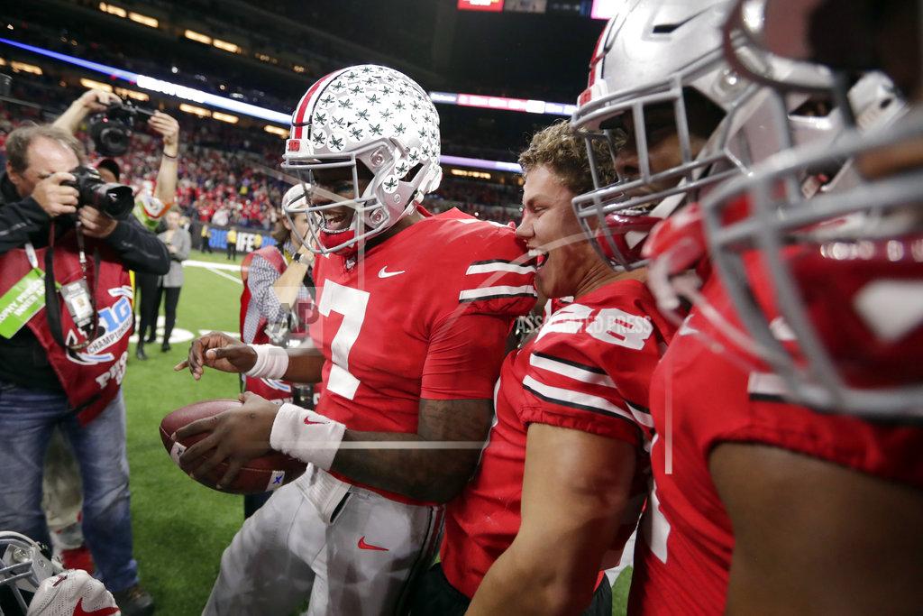 Michael Conroy Ohio State quarterback Dwayne Haskins (7) celebrates with teammates after defeating Northwestern 45-24 in the Big Ten championship NCAA college football game, early Saturday, Dec. 1, 2018, in Indianapolis. (AP Photo/Michael Conroy)