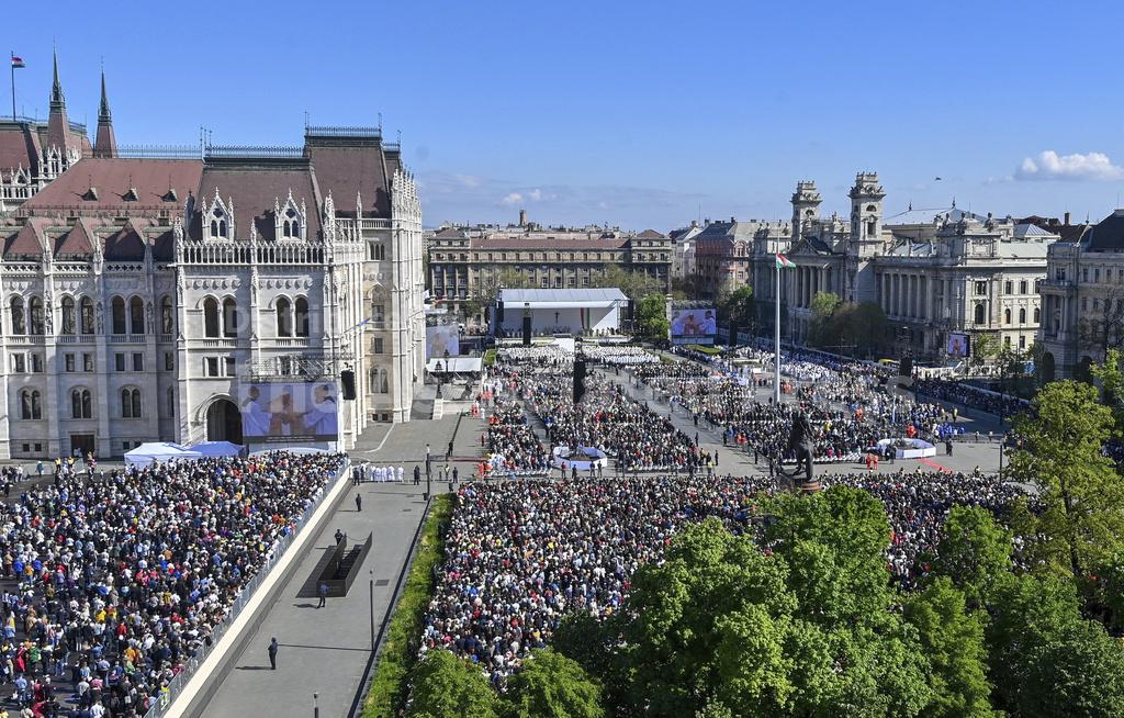 Tibor Illyes Pope Francis, seen also on a giant screens, celebrates mass in Kossuth Lajos Square in Budapest, Hungary, Sunday, April 30, 2023. (Tibor Illyes/MTI via AP)