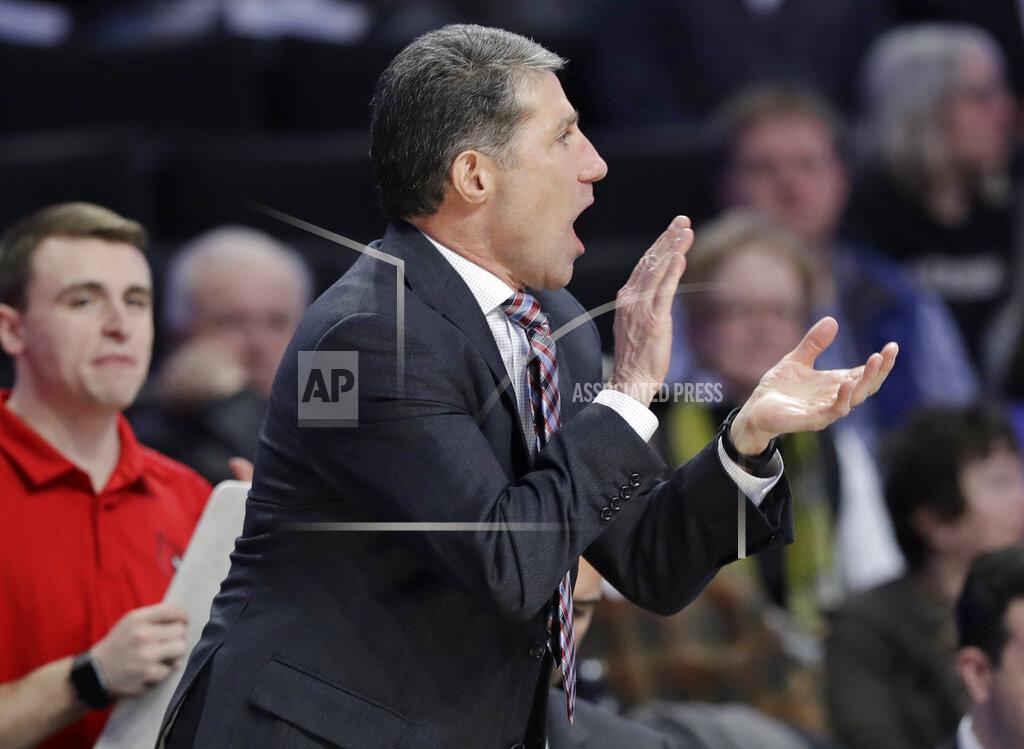 Chuck Burton Louisville assistant coach Dino Gaudio cheers on his team against Wake Forest during the second half of an NCAA college basketball game in Winston-Salem, N.C., Wednesday, Jan. 30, 2019. (AP Photo/Chuck Burton)