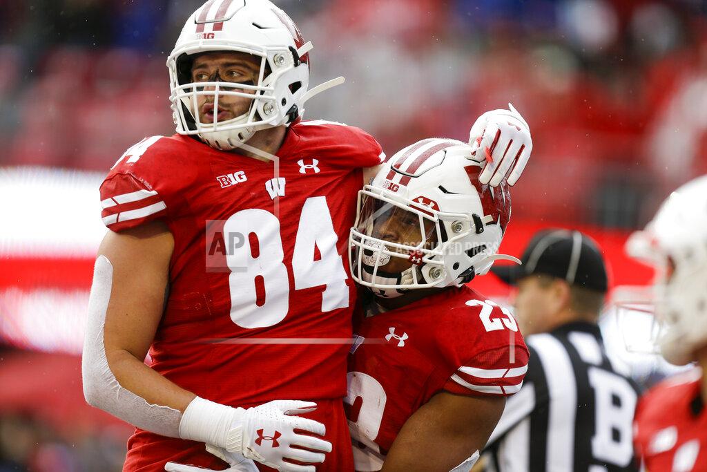 Andy Manis Wisconsin tight end Jake Ferguson (84) and running back Jonathan Taylor celebrate Tylor's touchdown against Kent State during the first half of an NCAA college football game Saturday, Oct. 5, 2019, in Madison, Wis. (AP Photo/Andy Manis)