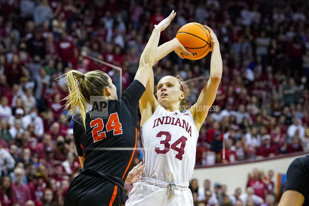 Michael Conroy Indiana guard Grace Berger (34) shoots over Princeton guard Julia Cunningham (24) in the second half of a college basketball game in the second round of the NCAA tournament in Bloomington, Ind., Monday, March 21, 2022. Indiana defeated Princeton 56-55. (AP Photo/Michael Conroy)