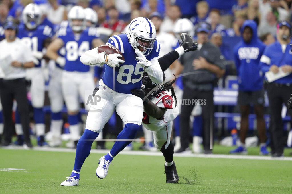 Michael Conroy Indianapolis Colts tight end Eric Ebron (85) is tackled by Atlanta Falcons outside linebacker De'Vondre Campbell (59) during the first half of an NFL football game, Sunday, Sept. 22, 2019, in Indianapolis. (AP Photo/Michael Conroy)