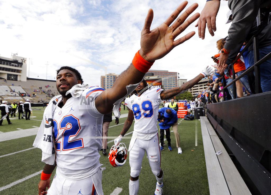 Mark Humphrey Florida running back Lamical Perine (22) celebrates with fans after the Gators defeated Vanderbilt 37-27 in an NCAA college football game Saturday, Oct. 13, 2018, in Nashville, Tenn. (AP Photo/Mark Humphrey)