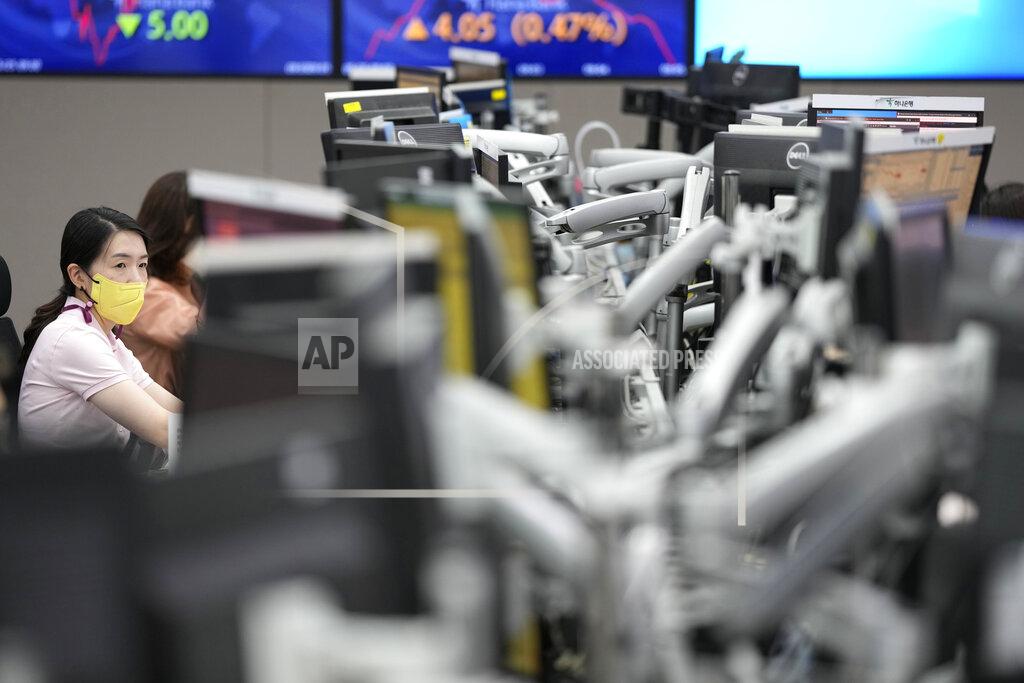 Lee Jin-Man A currency trader watches computer monitors at a foreign exchange dealing room in Seoul, South Korea, Wednesday, May 25, 2022. Asian stock markets were mixed Wednesday after Wall Street sank on weak U.S. housing sales and a profit warning by a prominent social media brand. (AP Photo/Lee Jin-man)