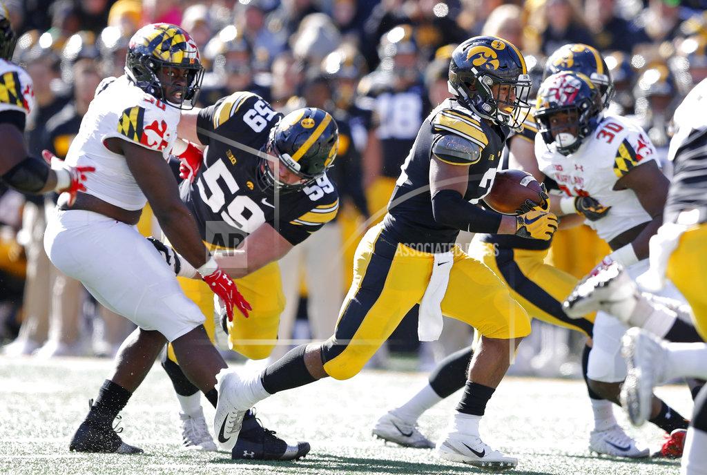Charlie Neibergall Iowa running back Ivory Kelly-Martin, right, carries the ball up field during the second half of an NCAA college football game against Maryland, Saturday, Oct. 20, 2018, in Iowa City, Iowa. Iowa won 23-0. (AP Photo/Charlie Neibergall)