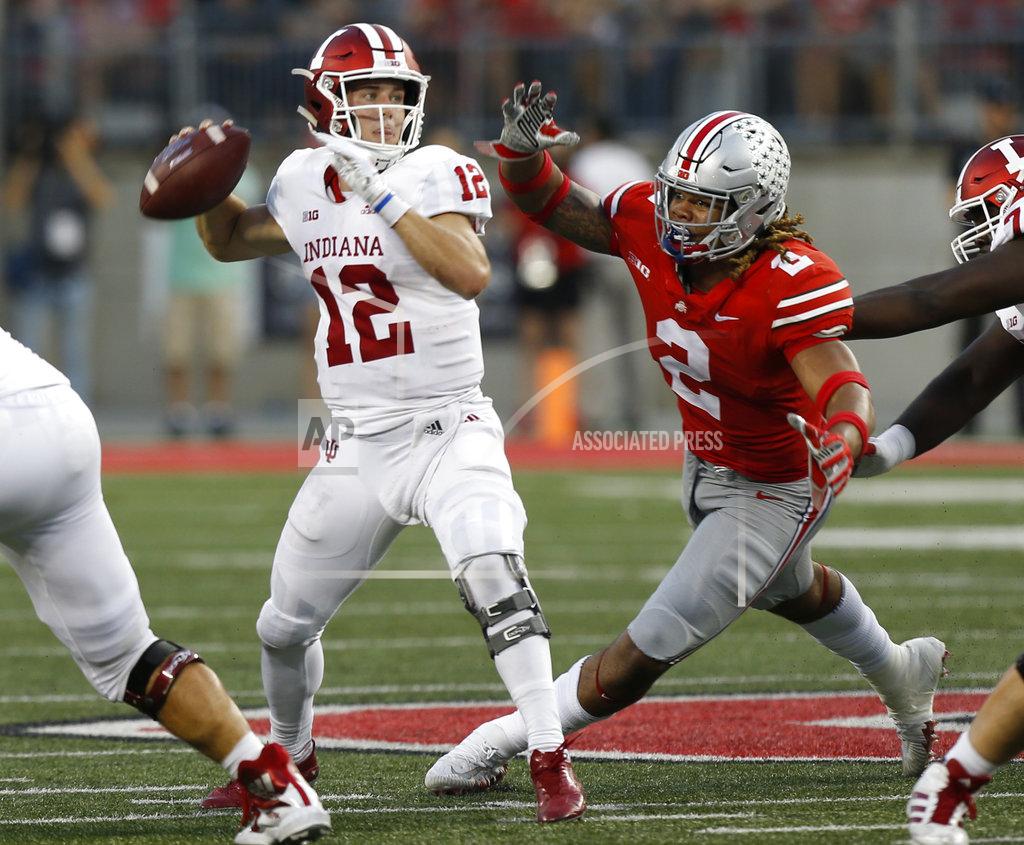 Jay Laprete Indiana quarterback Peyton Ramsey, left, throws a pass just before being hit by Ohio State defensive end Chase Young during the second half of an NCAA college football game Saturday, Oct. 6, 2018, in Columbus, Ohio. (AP Photo/Jay LaPrete)