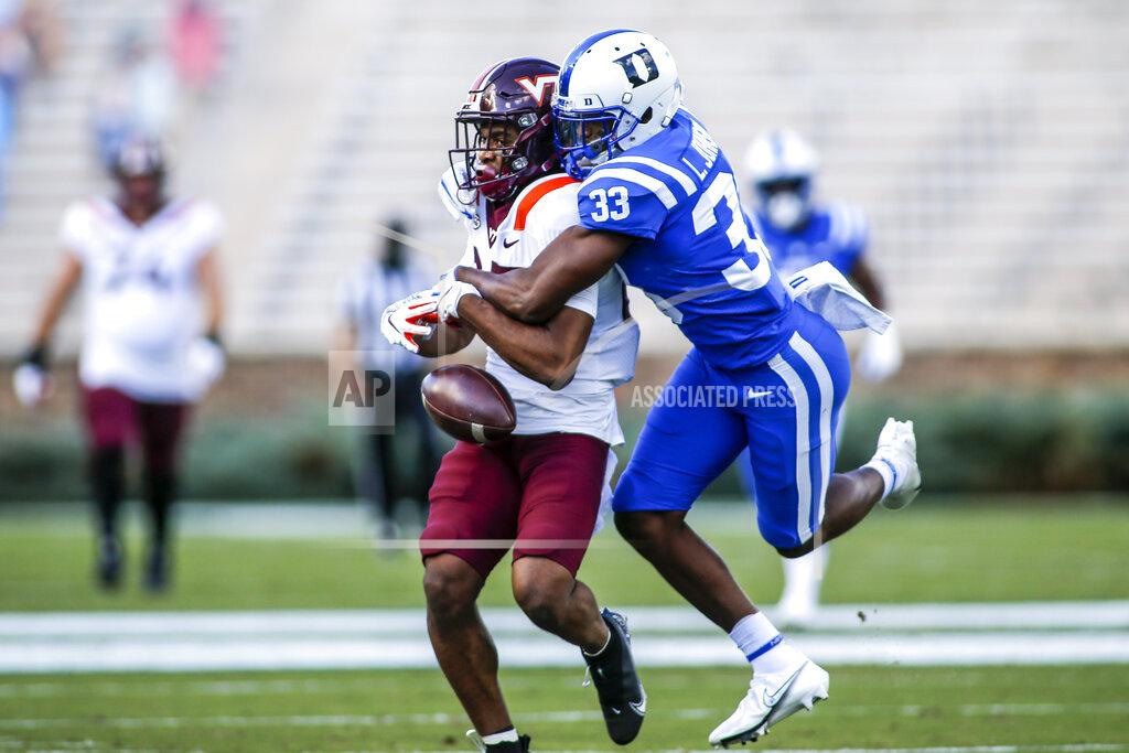 Nell Redmond Duke cornerback Leonard Johnson (33) breaks up a pass intended for Virginia Tech wide receiver Tayvion Robinson (83) during the first half of an NCAA college football game, Saturday, Oct. 3, 2020, in Durham, N.C. (Nell Redmond/Pool Photo via AP)