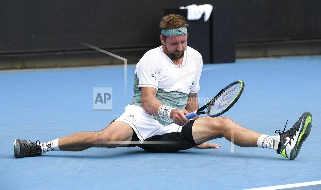 Andrew Brownbill United States' Tennys Sandgren falls during his match against Australia's John-Patrick Smith at a tuneup tournament ahead of the Australian Open tennis championships in Melbourne, Australia, Tuesday, Feb. 2, 2021. (AP Photo/Andrew Brownbill)