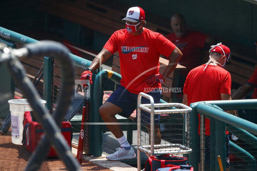 Carolyn Kaster Washington Nationals' manager David Martinez looks out from the dugout during a baseball training camp workout at Nationals Stadium, Sunday, July 5, 2020, in Washington. (AP Photo/Carolyn Kaster)