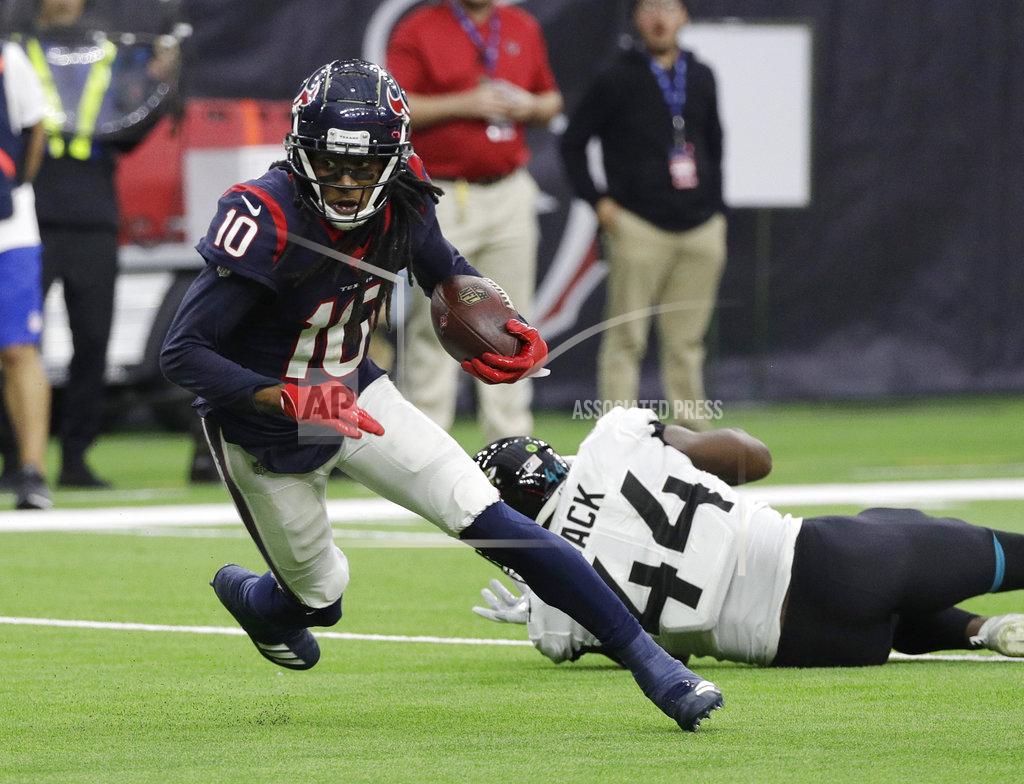 David J. Phillip Houston Texans wide receiver DeAndre Hopkins (10) runs past Jacksonville Jaguars middle linebacker Myles Jack (44) after making a catch during the first half of an NFL football game, Sunday, Dec. 30, 2018, in Houston. (AP Photo/David J. Phillip)