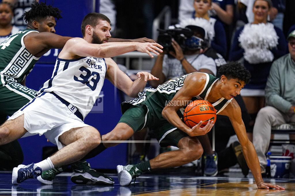 Michael Conroy Michigan State guard Max Christie (5) and Butler forward Bryce Golden (33) fight for a rebound in the second half of an NCAA college basketball game in Indianapolis, Wednesday, Nov. 17, 2021. Michigan State defeated Butler 73-52. (AP Photo/Michael Conroy)