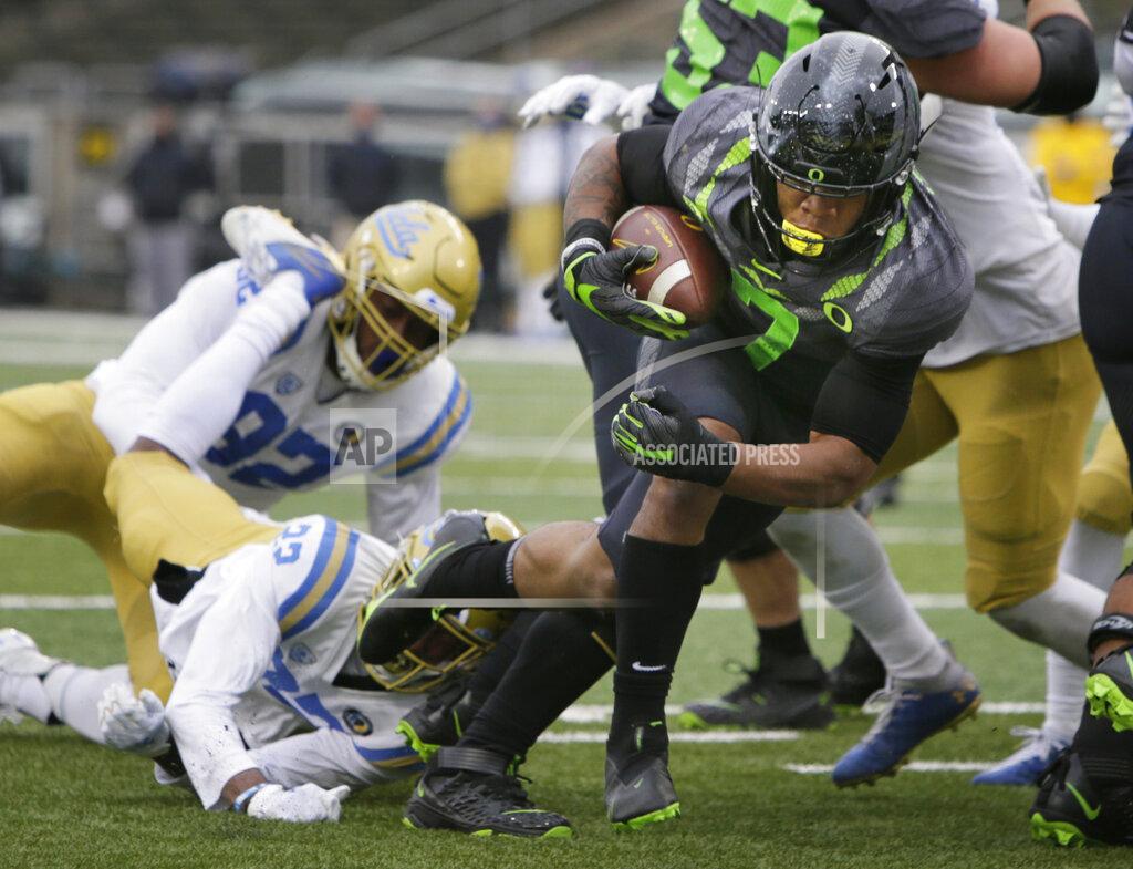 Chris Pietsch Oregon's CJ Verdell dives into the end zone for a third-quarter score against UCLA in an NCAA college football game Saturday, Nov. 21, 2020, in Eugene, Ore. (AP Photo/Chris Pietsch)