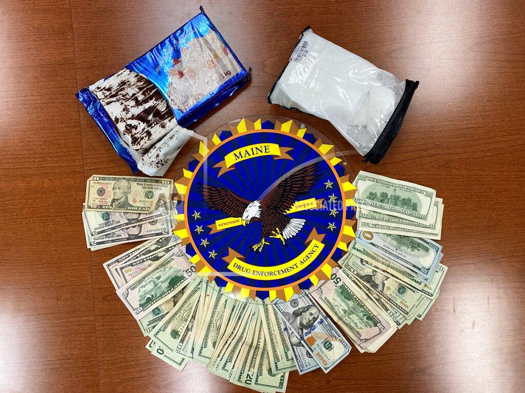 Uncredited This undated photo provided by the Maine Drug Enforcement Agency shows a marble cake which contained about 2 pounds of cocaine, and cash, seized from a vehicle in Gardiner, Maine. A New York man and a Maine woman are facing charges, Wednesday, July 21, 2021, after the cocaine disguised as a cake was seized from their vehicle, authorities said. (Maine Drug Enforcement Agency via AP)