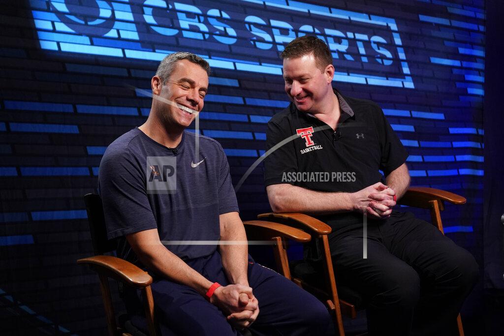 David J. Phillip Virginia head coach Tony Bennett, left, and Texas Tech head coach Chris Beard talk as they arrive at an interview for CBS Sports Network's "We Need to Talk" show before the championship game of the Final Four NCAA college basketball tournament, Sunday, April 7, 2019, in Minneapolis. (AP Photo/David J. Phillip)
