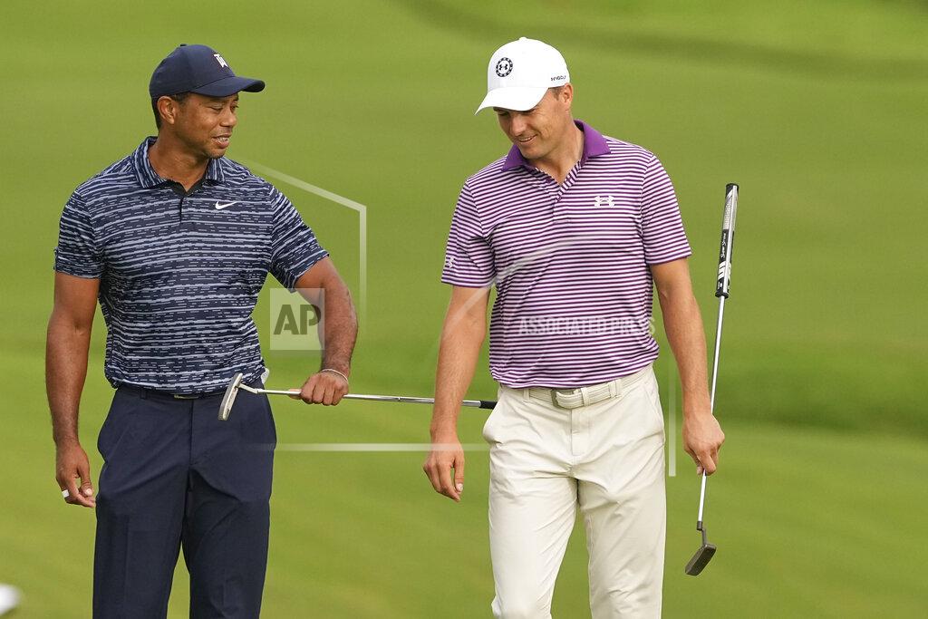 Matt York Tiger Woods and Jordan Spieth talk on the 10th green during the first round of the PGA Championship golf tournament, Thursday, May 19, 2022, in Tulsa, Okla. (AP Photo/Matt York)