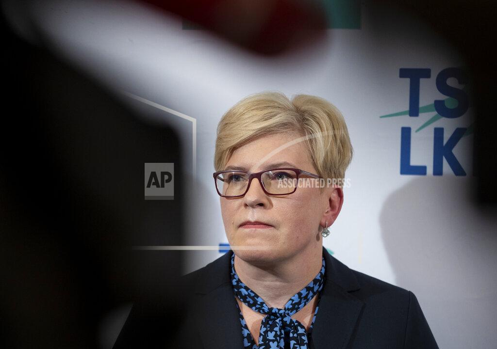 Mindaugas Kulbis Lithuania's Homeland Union–Lithuanian Christian Democrats party leader Ingrida Simonyte speaks to the media as she waits for the results of the first round Lithuania's parliamentary elections in Vilnius, Lithuania, Sunday, Oct. 11, 2020. Lithuanians have voted in the first round of the parliamentary election in which the electorate will choose 141 national lawmakers, and the ruling four-party coalition is facing a stiff challenge from the opposition. (AP Photo/Mindaugas Kulbis)